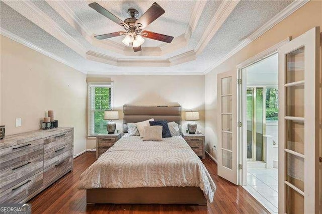 230 Oakmere Dr, Alpharetta, GA 30009 - bedroom with a tray ceiling, ornamental molding, a ceiling fan, and dark wood finished floors
