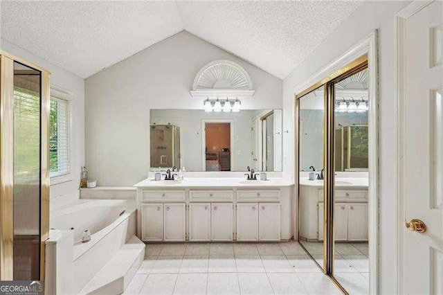 230 Oakmere Dr, Alpharetta, GA 30009 - bathroom featuring a textured ceiling, a sink, lofted ceiling, and tile patterned floors