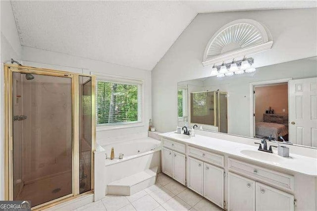 230 Oakmere Dr, Alpharetta, GA 30009 - bathroom with connected bathroom, vaulted ceiling, tile patterned flooring, a stall shower, and a garden tub