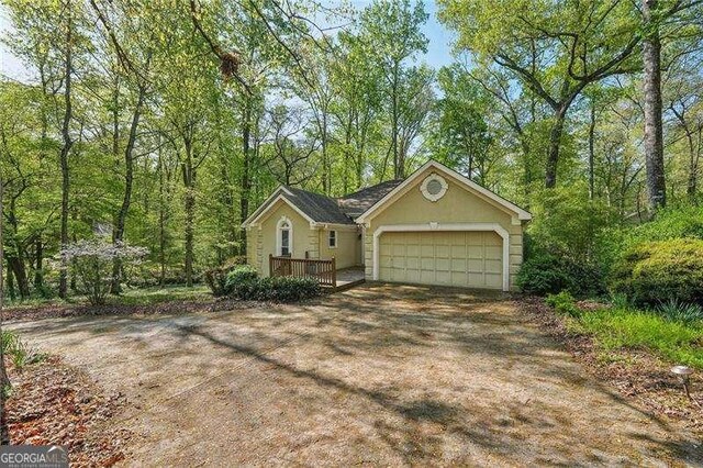 230 Oakmere Dr, Alpharetta, GA 30009 - view of front of house featuring a garage and driveway