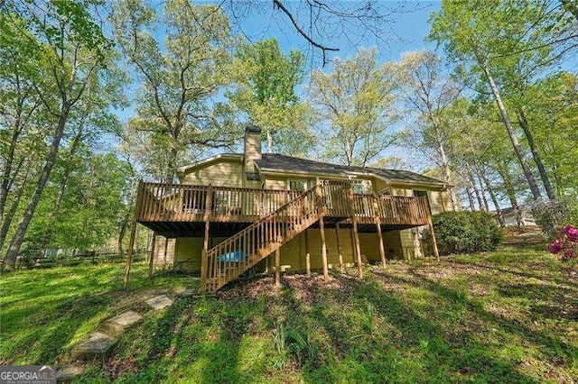 230 Oakmere Dr, Alpharetta, GA 30009 - rear view of house featuring a chimney, a lawn, a deck, and stairway