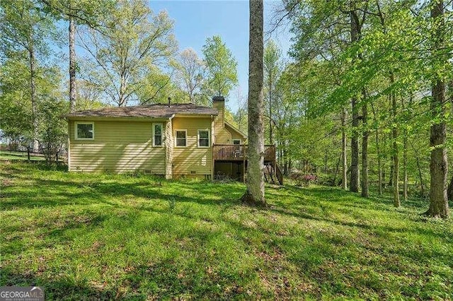 230 Oakmere Dr, Alpharetta, GA 30009 - rear view of house featuring a yard, a wooden deck, stairs, and a chimney