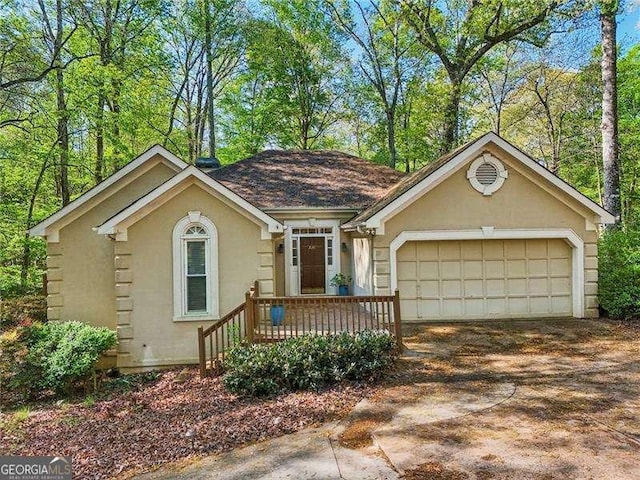 230 Oakmere Dr, Alpharetta, GA 30009 - single story home featuring an attached garage, driveway, and stucco siding