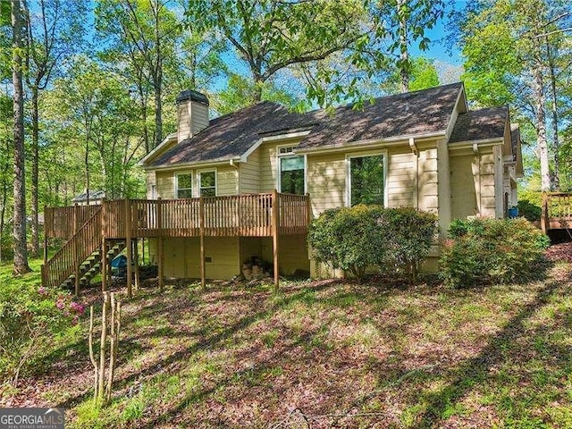 230 Oakmere Dr, Alpharetta, GA 30009 - back of property with stairway, a wooden deck, and a chimney