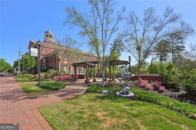 230 Oakmere Dr, Alpharetta, GA 30009 - view of community with a pergola and a yard