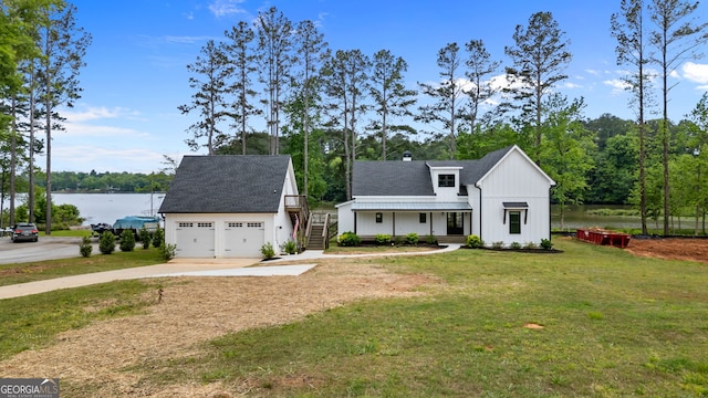 1001 Sugar Hill Way, Buckhead, GA 30625 - modern inspired farmhouse with board and batten siding, driveway, a front yard, roof with shingles, and a water view