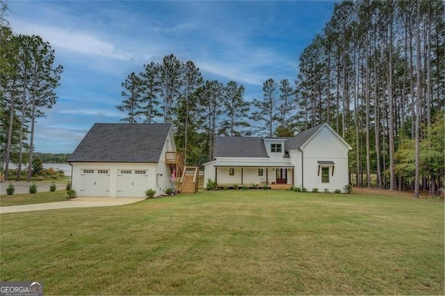 1001 Sugar Hill Way, Buckhead, GA 30625 - view of front of house featuring board and batten siding, concrete driveway, and a front yard