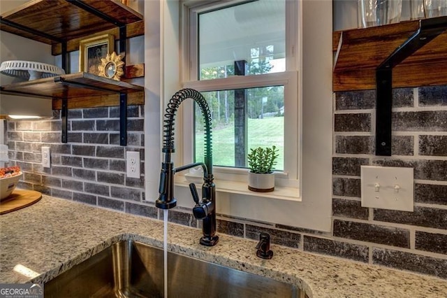 1001 Sugar Hill Way, Buckhead, GA 30625 - interior details featuring light stone counters, decorative backsplash, and a sink