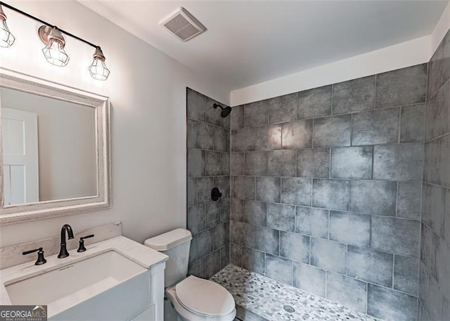 1001 Sugar Hill Way, Buckhead, GA 30625 - bathroom with visible vents, a tile shower, toilet, and vanity