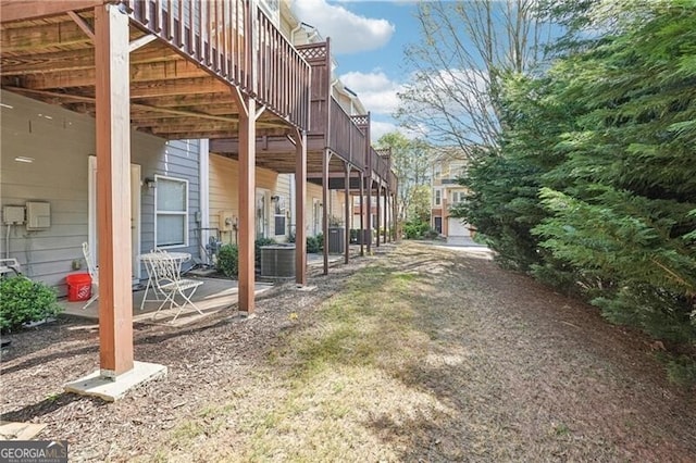 exterior space featuring central AC unit and a patio area