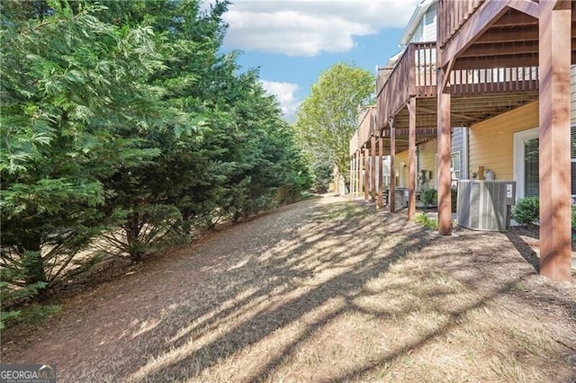 exterior space featuring central AC unit and stairs