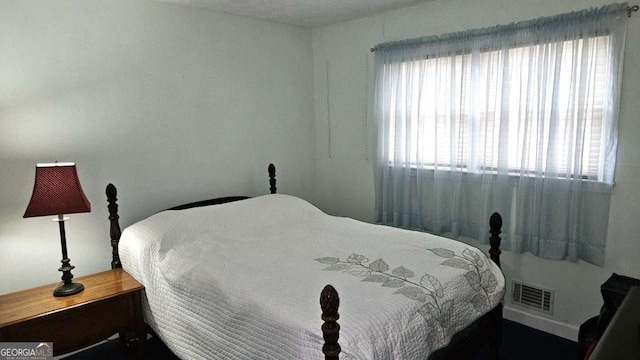 bedroom with visible vents