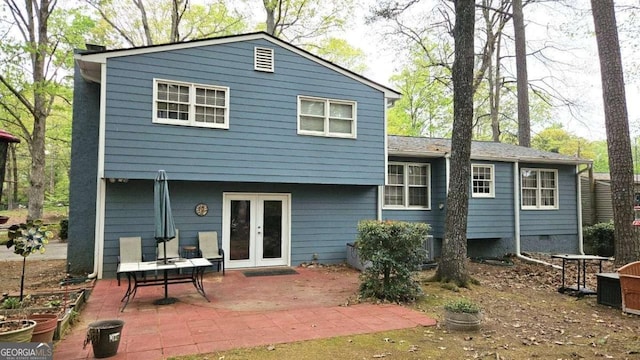 rear view of property featuring french doors and a patio