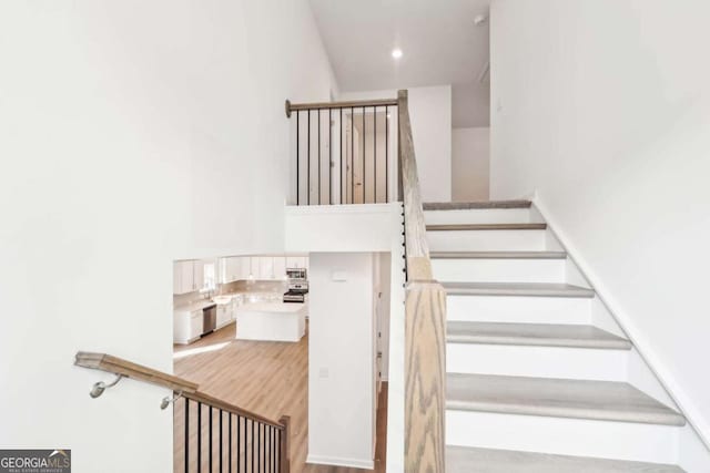 stairs with wood finished floors
