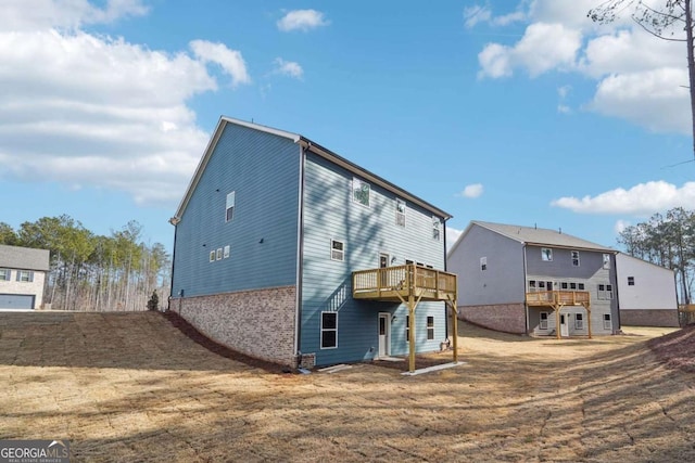 back of property featuring a deck