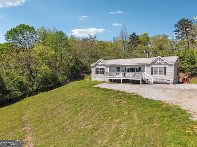 2496 Venture Dr, Gainesville, GA 30506 - manufactured / mobile home with a front lawn, a deck, crawl space, and gravel driveway
