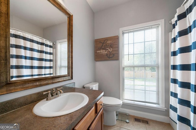 bathroom with visible vents, a shower with curtain, toilet, vanity, and tile patterned floors