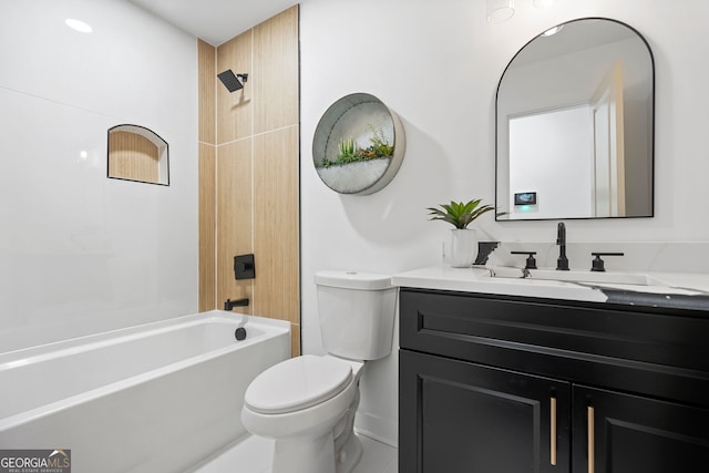 bathroom with vanity, shower / bathing tub combination, and toilet