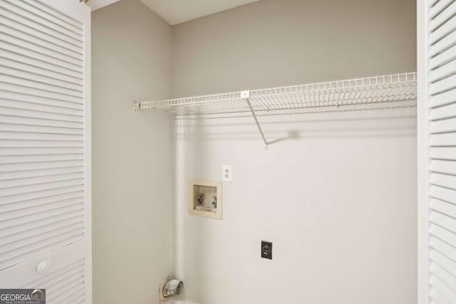 laundry area featuring laundry area, hookup for an electric dryer, and hookup for a washing machine