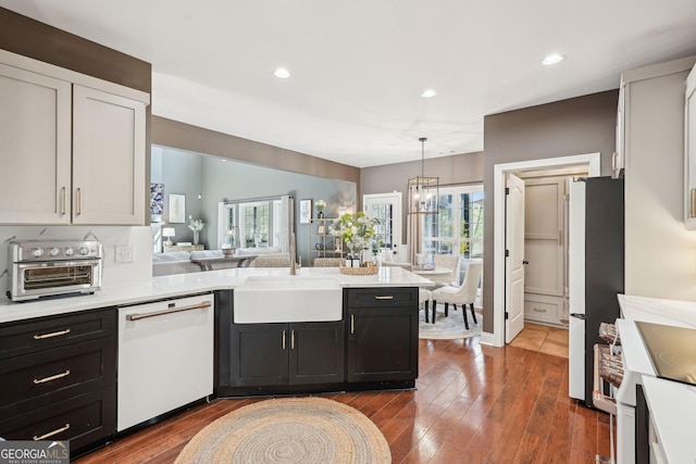 185 Starlight Dr, Dahlonega, GA 30533 - kitchen with a sink, open floor plan, light countertops, white appliances, and a peninsula