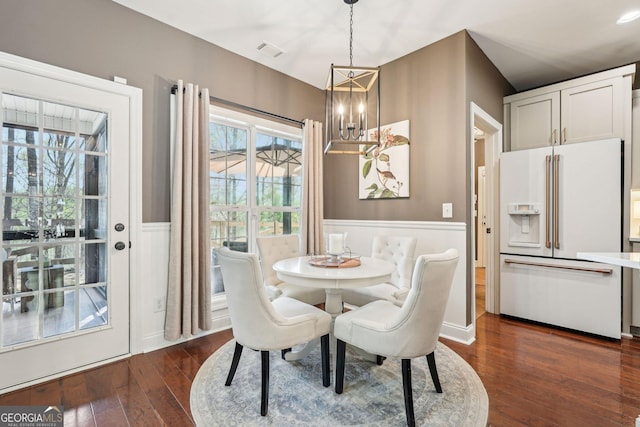 185 Starlight Dr, Dahlonega, GA 30533 - dining space featuring dark wood finished floors, a notable chandelier, visible vents, and wainscoting