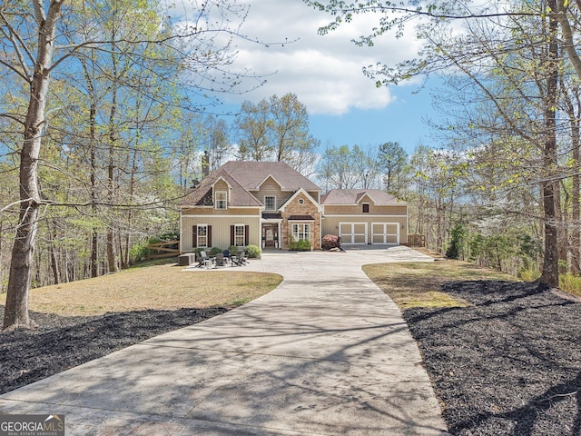185 Starlight Dr, Dahlonega, GA 30533 - craftsman-style home with concrete driveway, stone siding, and a garage
