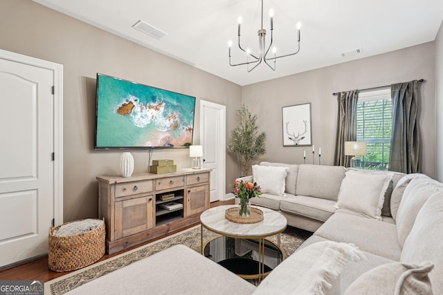 185 Starlight Dr, Dahlonega, GA 30533 - living room featuring a chandelier, wood finished floors, and visible vents