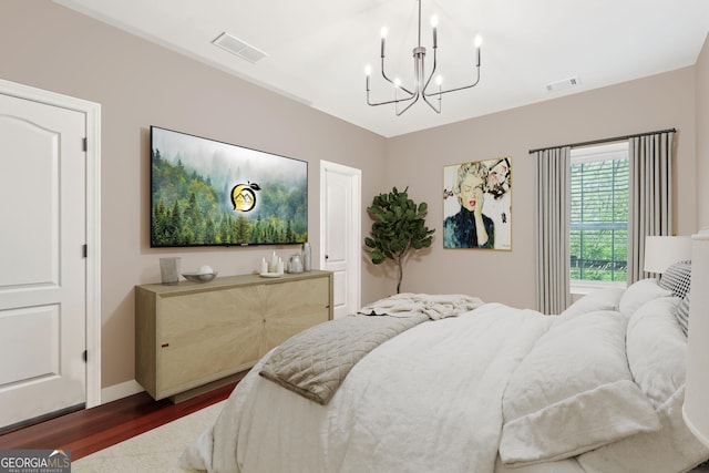 185 Starlight Dr, Dahlonega, GA 30533 - bedroom with a chandelier, visible vents, baseboards, and dark wood finished floors
