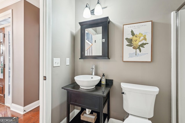 185 Starlight Dr, Dahlonega, GA 30533 - bathroom with vanity, baseboards, toilet, and wood finished floors