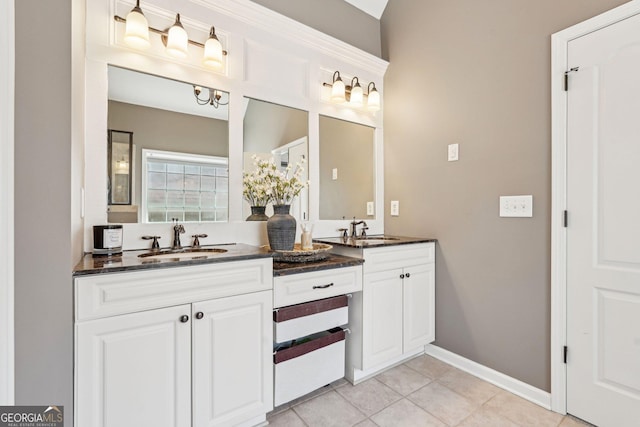 185 Starlight Dr, Dahlonega, GA 30533 - bathroom with tile patterned floors, double vanity, a sink, and baseboards