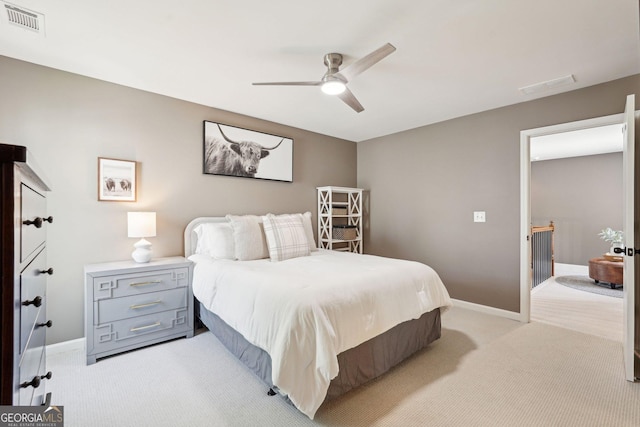 185 Starlight Dr, Dahlonega, GA 30533 - bedroom with visible vents, light colored carpet, baseboards, and ceiling fan
