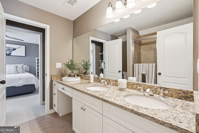 185 Starlight Dr, Dahlonega, GA 30533 - ensuite bathroom featuring tiled shower, double vanity, visible vents, and a sink
