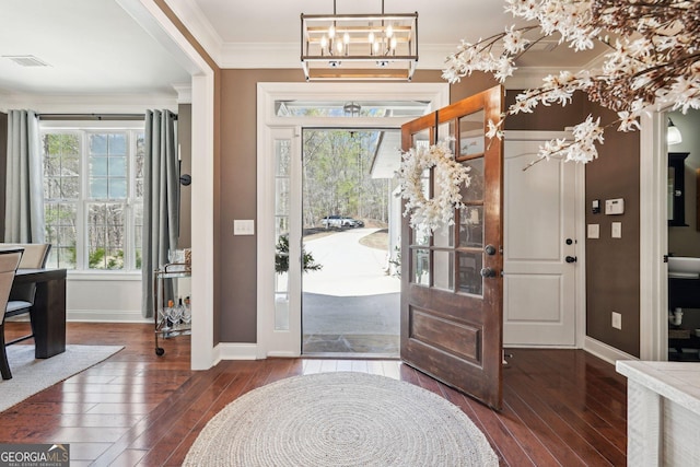 185 Starlight Dr, Dahlonega, GA 30533 - entryway featuring a notable chandelier, baseboards, crown molding, visible vents, and hardwood / wood-style flooring