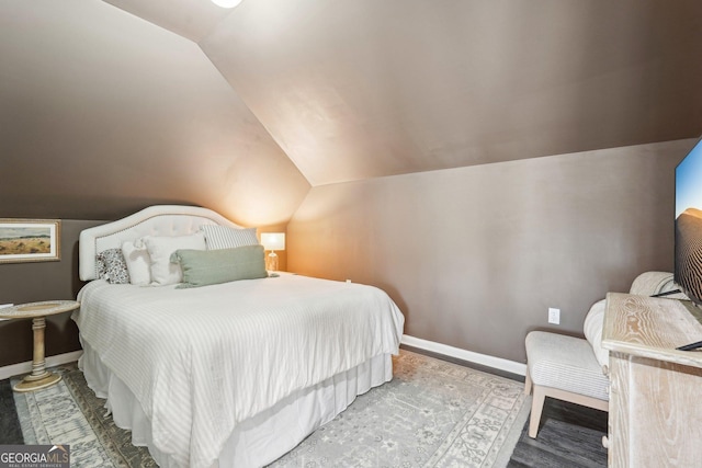 185 Starlight Dr, Dahlonega, GA 30533 - bedroom with baseboards, wood finished floors, and lofted ceiling
