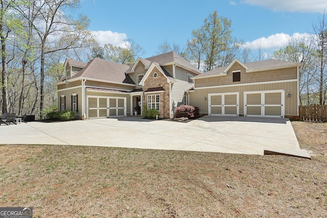 185 Starlight Dr, Dahlonega, GA 30533 - craftsman house with a garage, driveway, fence, and a shingled roof