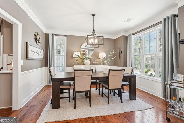 185 Starlight Dr, Dahlonega, GA 30533 - dining area with an inviting chandelier, visible vents, hardwood / wood-style floors, and ornamental molding