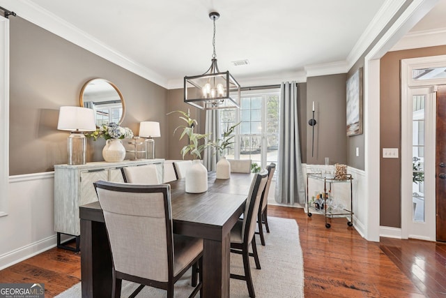 185 Starlight Dr, Dahlonega, GA 30533 - dining space with ornamental molding, visible vents, a chandelier, wood finished floors, and baseboards