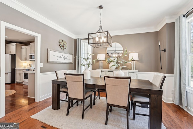 185 Starlight Dr, Dahlonega, GA 30533 - dining space with crown molding, a chandelier, and wood finished floors