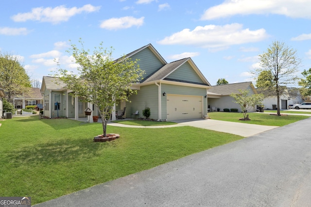 view of front of property with a front yard, driveway, and an attached garage