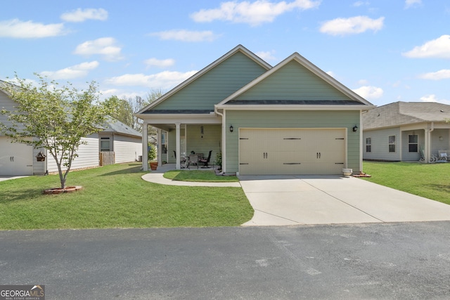 craftsman house with roof with shingles, a garage, a front yard, and driveway
