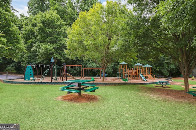 communal playground featuring a yard