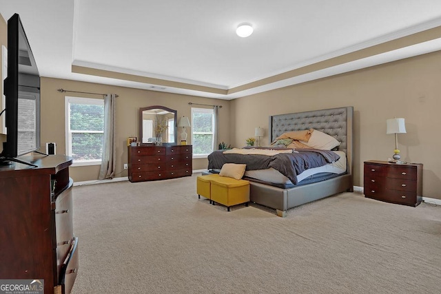 2384 Allsborough Way, Dacula, GA 30019 - carpeted bedroom featuring a tray ceiling, multiple windows, and baseboards