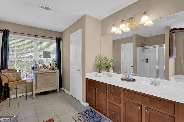 2384 Allsborough Way, Dacula, GA 30019 - bathroom featuring a shower stall, double vanity, tile patterned flooring, and baseboards