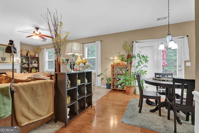2384 Allsborough Way, Dacula, GA 30019 - dining room with wood finished floors, a ceiling fan, and baseboards
