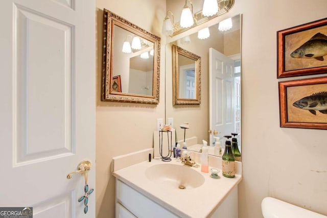 half bathroom featuring toilet and vanity