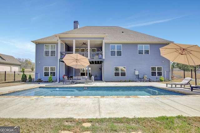 view of swimming pool featuring a patio area, an outdoor living space, fence, and ceiling fan