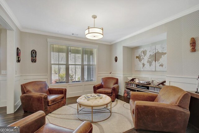 living area featuring wood finished floors and ornamental molding