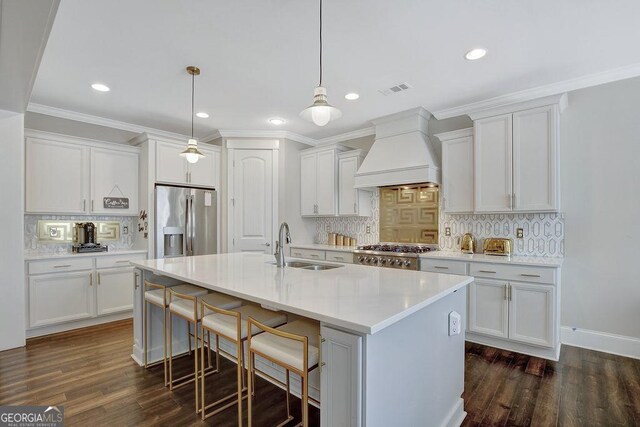 kitchen featuring custom range hood, tasteful backsplash, range, dark wood-style floors, and stainless steel refrigerator with ice dispenser