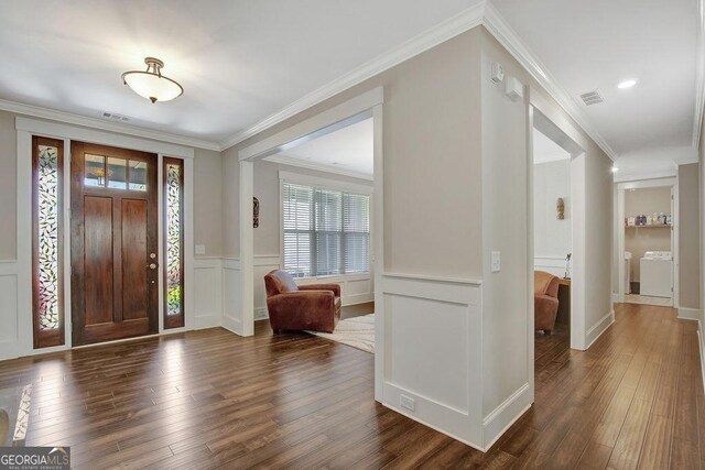 entryway featuring wainscoting, visible vents, and dark wood-style floors