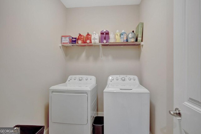 laundry room with independent washer and dryer and laundry area